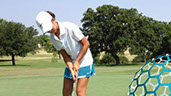 Junior golfer receiving instruction in Dallas/Fort Worth, Texas.